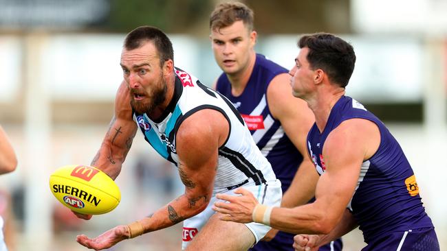 Charlie Dixon of the Power handballs the ball away during the AFL Practice Match between the Fremantle Dockers and the Port Adelaide Power. Picture: James Worsfold