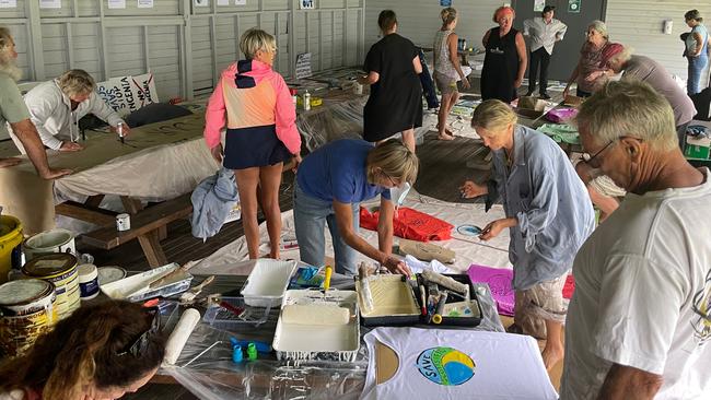 Save Scotts Head residents at a workshop creating banners protesting a proposed Ingenia overs 55s lifestyle village in the town.