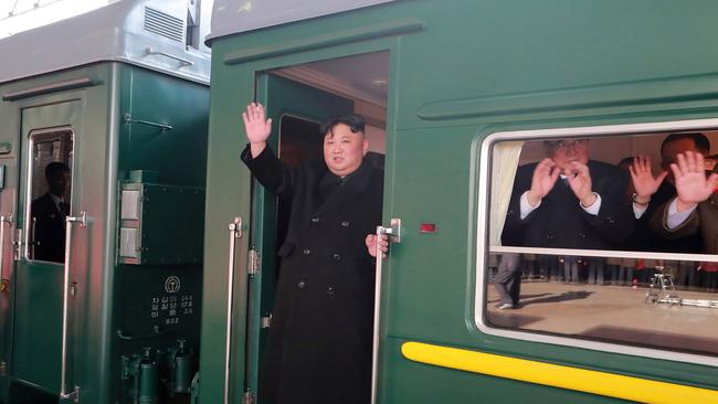 North Korean leader Kim Jong-un waves from a train before leaving Pyongyang Station for Vietnam to meet Donald Trump. Picture: Korea Central News Agency via AP