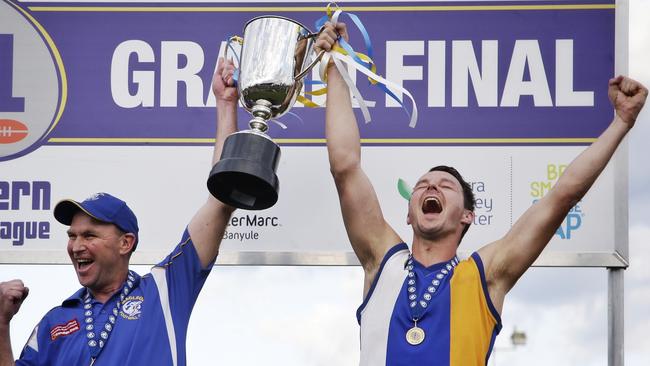 Coach Garry Ramsay and Macleod captain Kane Shaw after the club’s 2015 grand final victory. Picture: Hamish Blair