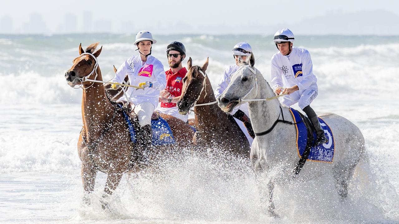 Horses cool off after the famous beach run at the Magic Millions barrier draw. Picture: Luke Marsden.