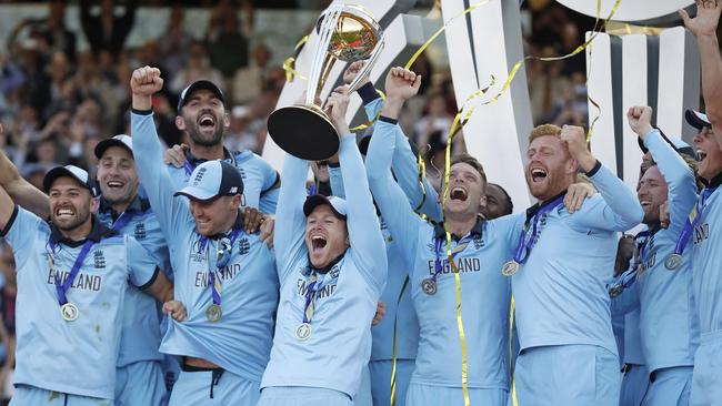 England cricketers celebrate with the World Cup trophy. Picture: AP