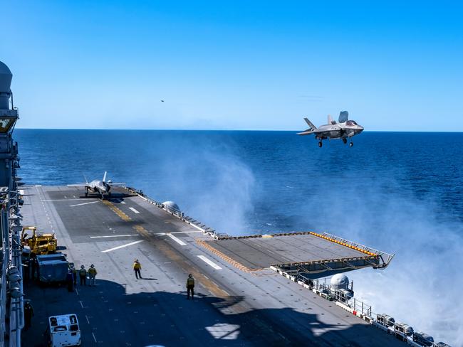 A U.S. Marine Corps F-35B Lightning II with Marine Fighter Attack Squadron 121 attached to Marine Medium Tiltrotor Squadron 265 (Reinforced), 31st Marine Expeditionary Unit (MEU), prepares to land on the flight deck aboard the amphibious assault ship USS America (LHA 6), during Talisman Sabre on July 17, 2021. The F-35B Lightning IIÃ¢â¬â¢s fifth generation strike fighter capabilities bring more lethality and flexibility to combat commanders than any other aircraft platform. Australian and U.S. forces combine biannually for Talisman Sabre, a month-long multi-domain exercise that strengthens allied and partner capabilities to respond to the full range of Indo-Pacific security concerns. The 31st MEU is operating aboard ships of America Expeditionary Strike Group in the 7th fleet area of operations to enhance interoperability with allies and partners and serve as a ready response force to defend peace and stability in the Indo-Pacific region. (U.S. Marine Corps photo by Staff Sgt. John Tetrault)