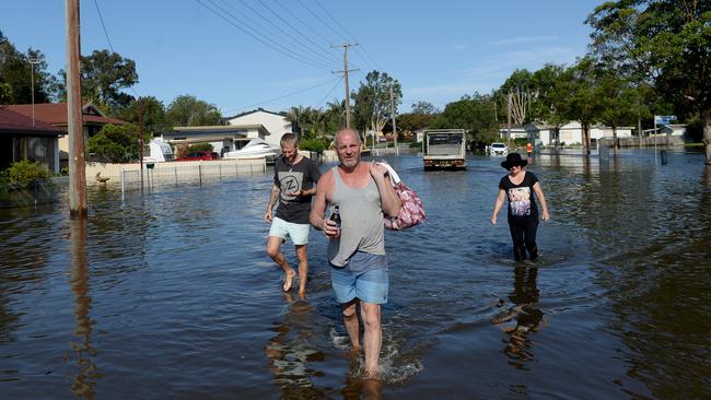 Residents of Geoffrey Road in Chittaway Bay, take to the flooded street. Sadly the region’s biggest dam did not get a similar run off. Photo Jeremy Piper