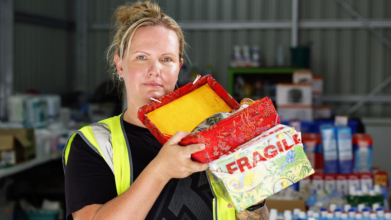 Volunteers at the Holloways Hub community donation centre have stumbled upon an urn with a person's ashes inside. Rennae Brant-Goodwin has been trying for two weeks to locate who the urn belongs to and reunite them. Picture: Brendan Radke