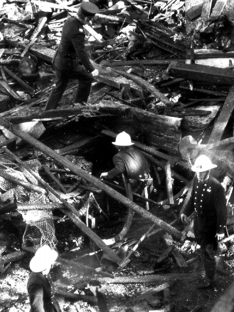 Firemen sift through remains of the ride. Picture: Uwe Kuessner