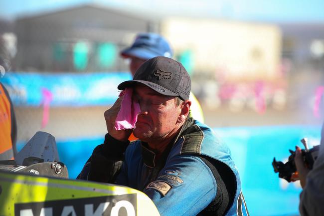 Dean Terry wipes his face after finishing the 2019 Tatts Finke Desert race. Pic: MATT HENDERSON