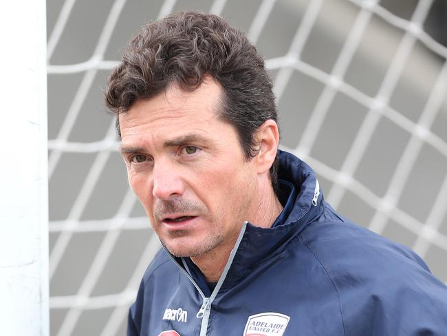 Guillermo Amor (Coach, Adelaide United) helps move soccer goals. Adelaide United Soccer training at Hindmarsh Stadium this morning, for the FFA Cup clash. 02/08/16 Picture: Stephen Laffer