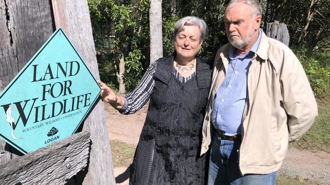 Chambers Flat residents Harriet and Kenneth Aitken at their front gate which is part of the land the council will resume.