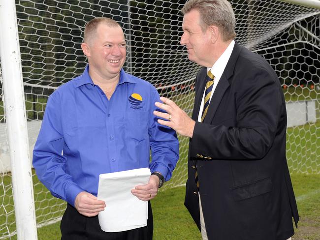 Chairman of Central Coast Football Darren Sprod (left) speaks to former NSW premier Barry O’Farrell.