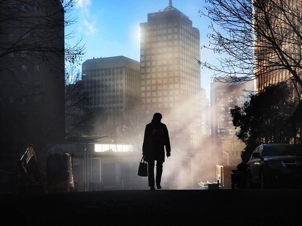 Farwell winter. A commuter heads to work as the fog lifts into beautiful blue skies with warm weather in Sydney expected over the next few days. Picture: Phil Hillyard