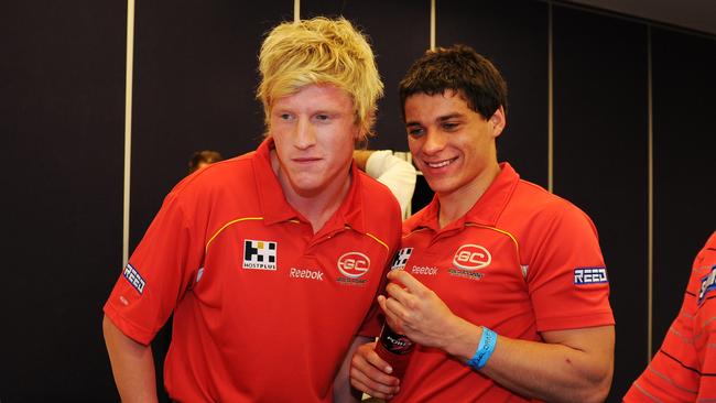 Gold Coast teammates Josh Caddy and Dion Prestia on draft night.