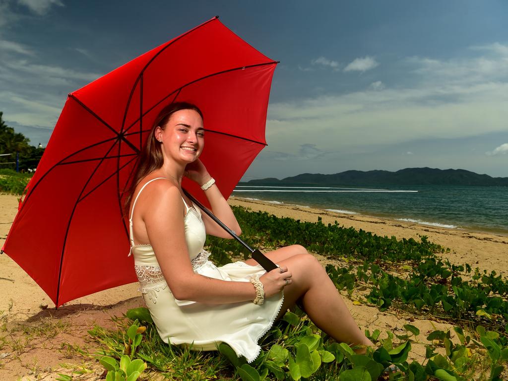 Sunnie-Rose Robinson from the Sunshine Coast enjoys a sunny morning on the Strand ahead of the expected rain. Picture: Evan Morgan