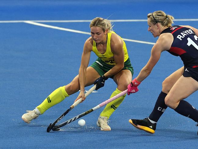 LONDON, ENGLAND - JUNE 12:  Claire Colwill of Australia is challenged by Elena Rayer during the FIH Pro League Women's match between Australia and Great Britain at Lee Valley Hockey and Tennis Centre on June 12, 2024 in London, England. (Photo by David Rogers/Getty Images)