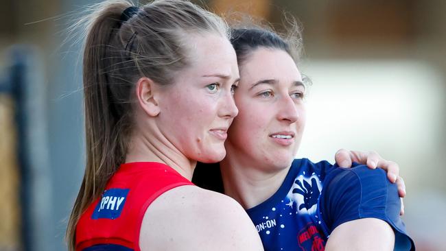 MELBOURNE, AUSTRALIA - SEPTEMBER 16: Teammates Eden Zanker and Alyssa Bannan of the Demons embrace during the 2023 AFLW Round 03 match between the Melbourne Demons and the Western Bulldogs at Casey Fields on September 16, 2023 in Melbourne, Australia. (Photo by Dylan Burns/AFL Photos via Getty Images)