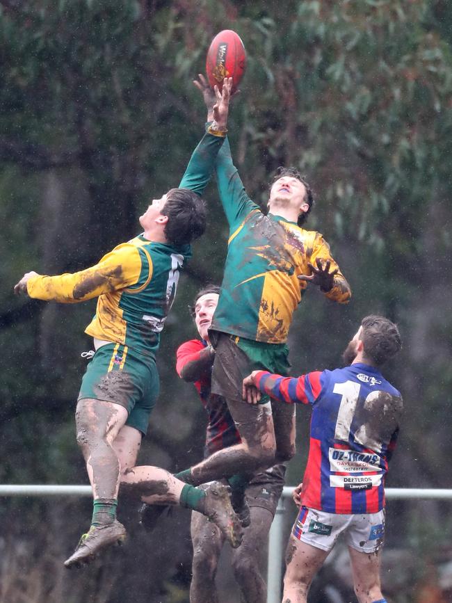 Gordon’s Sam Griffiths competes with a teammate in the air against Hepburn.