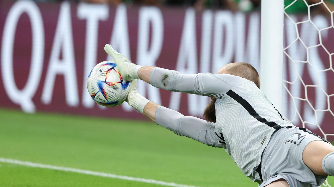 Andrew Redmayne of Australia saves the winning the penalty to send Australia to Qatar.