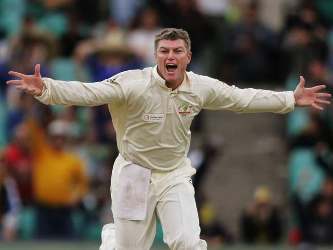 Stuart MacGill celebrates dismissing Virender Sehwag.