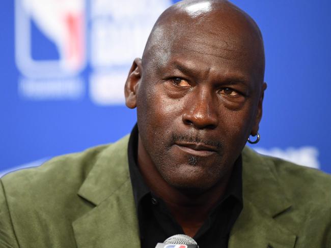 (FILES) In this file photo taken on January 24, 2020 former NBA star and owner of Charlotte Hornets team Michael Jordan looks on as he addresses a press conference ahead of the NBA basketball match between Milwaukee Bucks and Charlotte Hornets at The AccorHotels Arena in Paris. - Michael Jordan said June 5, 2020, he is making a record $100 million donation to groups fighting for racial equality and social justice amid a wave of protests across the United States. (Photo by FRANCK FIFE / AFP)