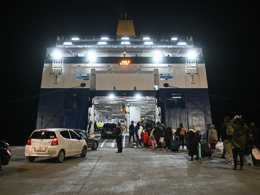 People embark a ferry as they leave in the wake of recurring earthquakes, on the Greek Island of Santorini, on February 4. Picture: STR / AFP