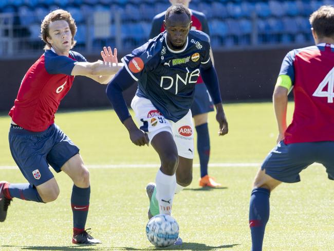 Bolt on the ball during the friendly match against Norway's U19 team. Picture: AFP