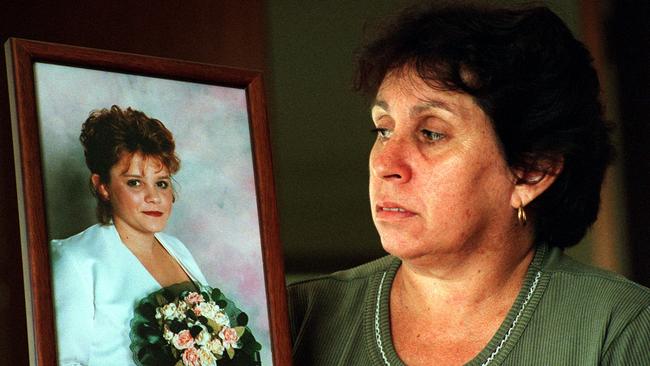 Loraine Bright holds photo of her murdered daughter Michelle at her Gulgong home.