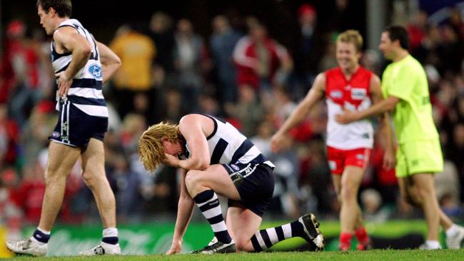 Cameron Ling slumps to the ground as the siren sounds.