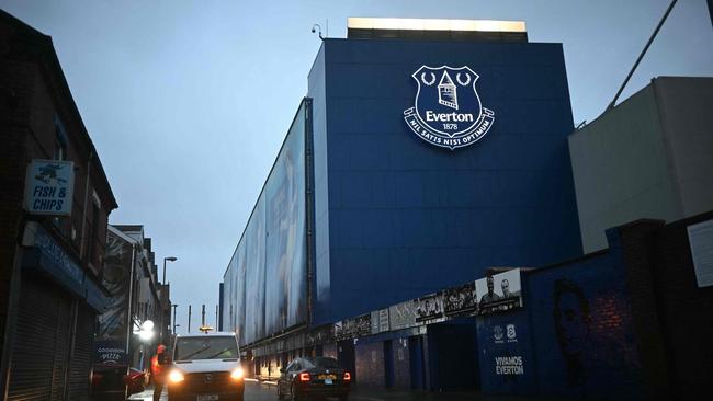 Street scenes around the ground as news of the postponement of the English Premier League football match between Everton and Liverpool spreads. (Photo by Paul ELLIS / AFP)