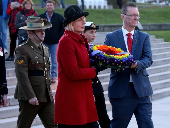 Catherine McGregor lays a wreath for the LGBTI community after the 2018 Anzac Day Dawn Service at the Australian War Memorial in Canberra. Picture: Kym Smith