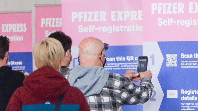 People checking in as they enter the Wayville vaccination hub. Picture: NCA NewsWire /Brenton Edwards