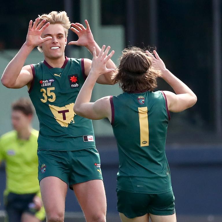 Sam Banks-Smith and Brandon Leary celebrate a goal for Tasmania in the Under-18 competition.