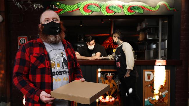 Jarrod Martin picks up a free meal at The Duke of Enmore pub. Jane Dempster/The Australian.