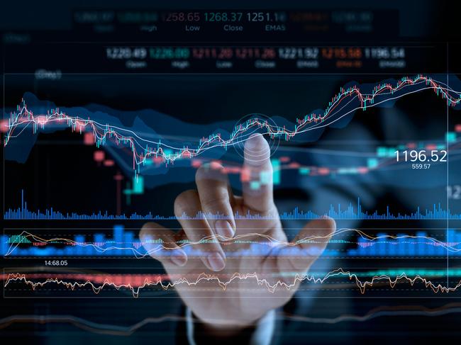 Businessman touching stock market graph on a virtual screen display.