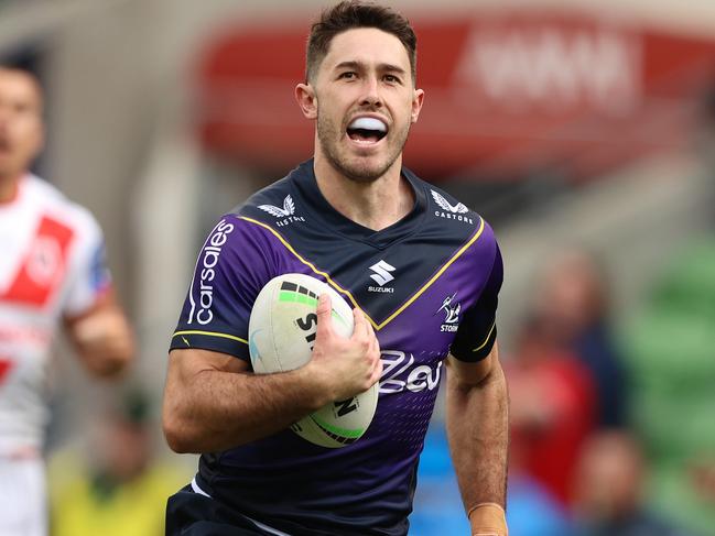 MELBOURNE, AUSTRALIA - MAY 08: Nick Meaney of the Storm makes a break on ho\\is way to scoring a try during the round nine NRL match between the Melbourne Storm and the St George Illawarra Dragons at AAMI Park, on May 08, 2022, in Melbourne, Australia. (Photo by Robert Cianflone/Getty Images)