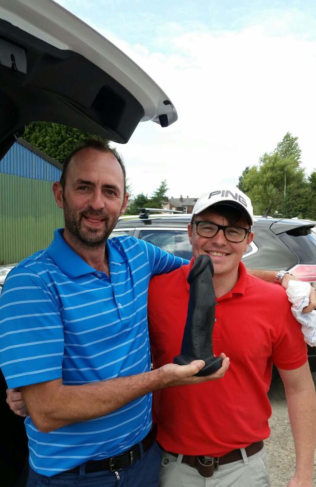 Ste Harrison and Billy Johnson at the fundraiser, holding the prized dildo.