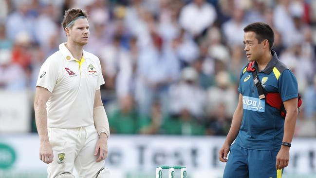 Australia's Steve Smith receives treatment after being felled by a Jofra Archer bouncer. (AP Photo/Alastair Grant)