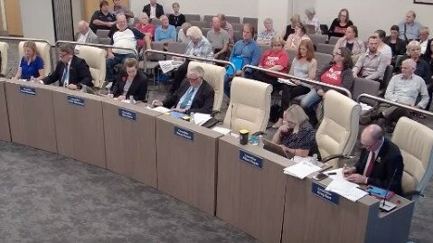 A railing is all that divides councillors from the gallery.