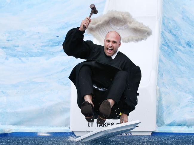 Former Carlton player Chris Judd goes down the slide for FightMND's Big Freeze 5 during the AFL Round 12 match between Collingwood v Melbourne at Melbourne Cricket Ground on June 10 (Photo: Michael Dodge/AFL Photos/Getty Images)