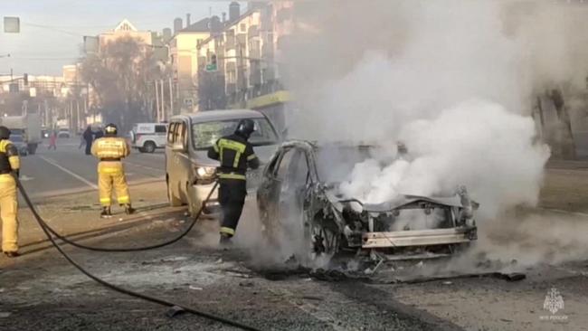 Firefighters extinguish flames after the shelling in Belgorod on Saturday. Picture: AFP