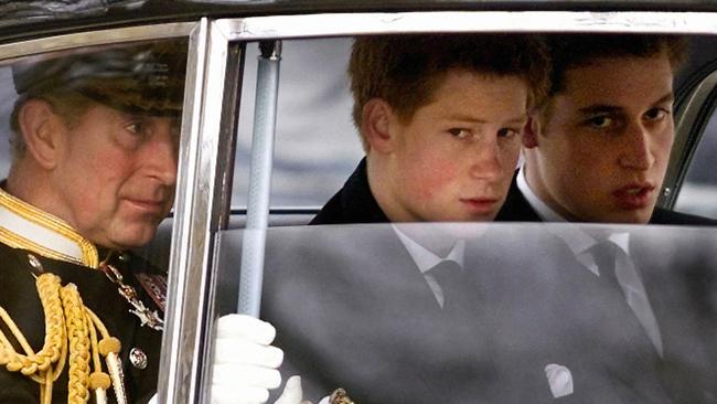 Charles (L) and his sons Prince Harry (C) and Prince William enroute to the Queen Mother's funeral service on 30 March, 2002. Picture: AFP