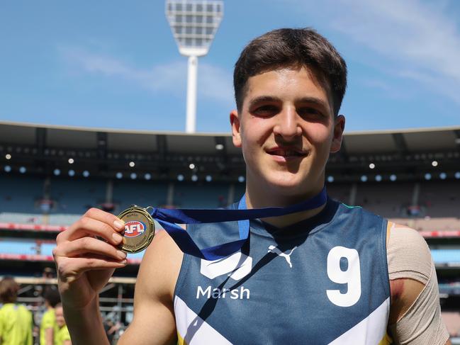 MELBOURNE, AUSTRALIA - SEPTEMBER 28: Josh Lindsay of Team Heppell poses with the best Team Heppell player medal during the Marsh AFL National Futures Boys match between Team Heppell and Team Sloane at Melbourne Cricket Ground, on September 28, 2024, in Melbourne, Australia. (Photo by Daniel Pockett/AFL Photos/via Getty Images)