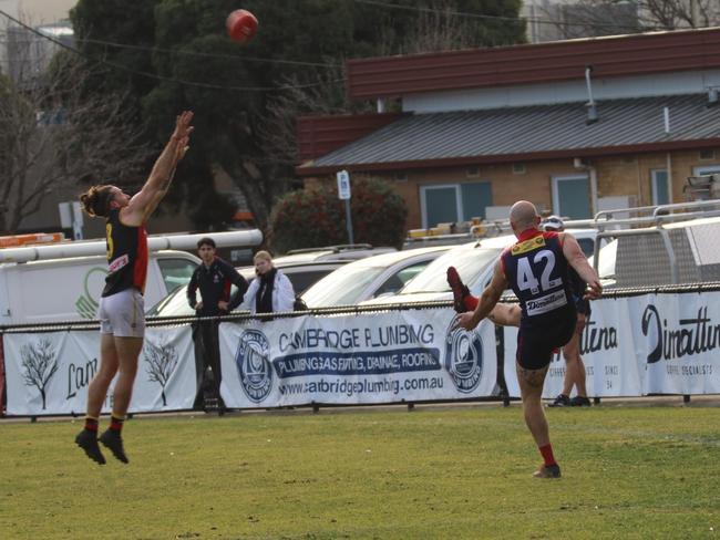 Bentleigh’s Callum launches a kick.