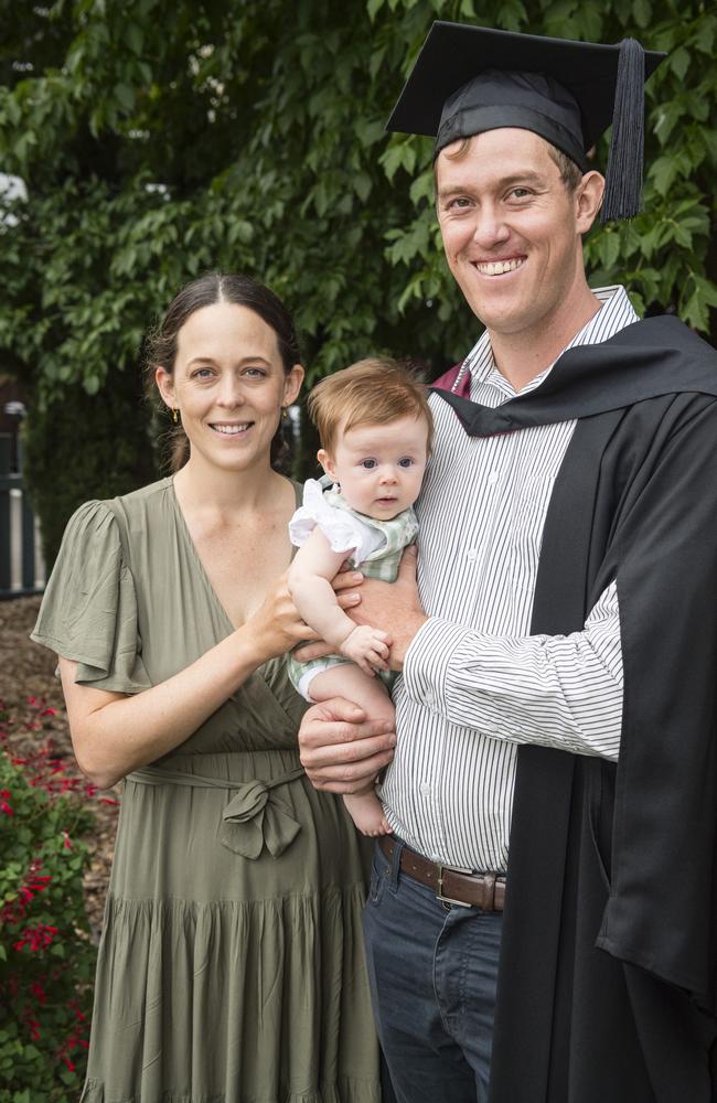 Bachelor of Spatial Science (Honours) graduate Aaron Jamieson with daughter Adeline Jamieson and partner Caitlyn Henderson at a UniSQ graduation ceremony at Empire Theatres, Tuesday, February 13, 2024. Picture: Kevin Farmer