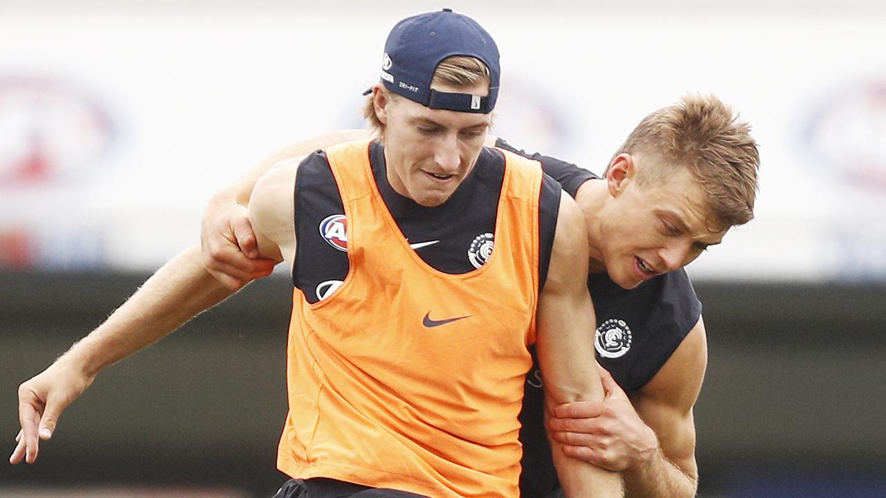 Carlton star Patrick Cripps, right, battles for the ball with recruit Will Setterfield.