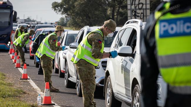 Reservists soldiers from Royal Victoria Regiment 5th/6th Battalion assist police with testing at the Little River Police vehicle checkpoint in Victoria.