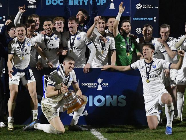 NPL: Football Victoria - Metropolitan / Dockerty Cup, Oakleigh Cannons FC vs South Melbourne FC at Main Pitch, Sports Drive, Bundoora, Victoria, Saturday 3rd August 2024: The victorious South Melbourne team hold the Dockerty Cup.  Photo: Andrew Batsch