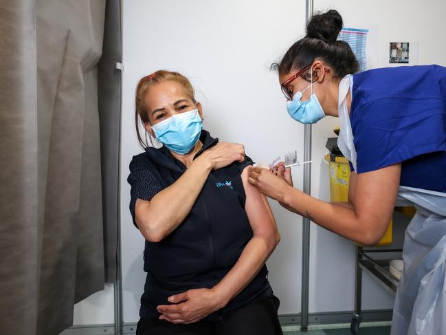 BlueCross Aged Care worker Isabelita Tassone receives the AstraZeneca vaccine at Sunshine Hospital. Picture : Ian Currie