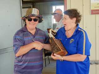 NEW CHAMPIONS: President of the Rotary Club Glen Hay hands over the trophy to the Lions Club, represented by Julianne Shipway. Picture: Contributed