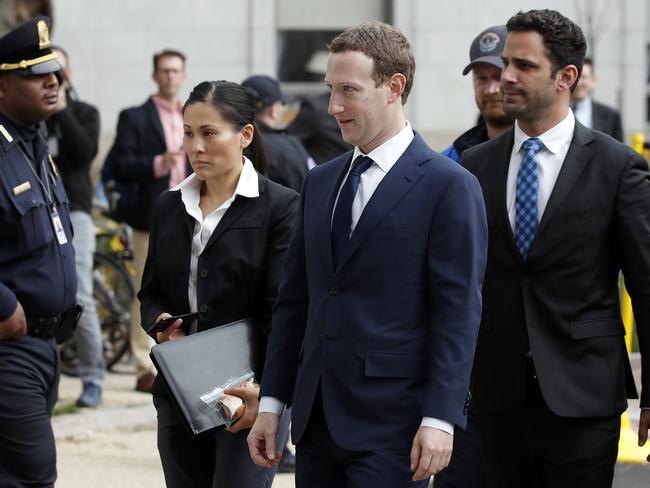 Facebook CEO Mark Zuckerberg, centre, arrives to testify before a House Energy and Commerce hearing. Picture: AP