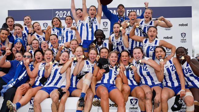 MELBOURNE, AUSTRALIA - JULY 21: The Kangaroos pose for their premiership photo during the 2024 rebel VFLW Grand Final match between North Melbourne and the Western Bulldogs at ETU Stadium on July 21, 2024 in Melbourne, Australia. (Photo by Dylan Burns/AFL Photos)